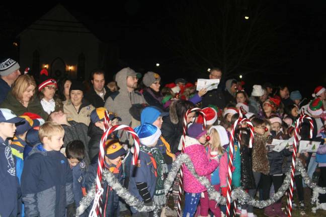 Several hundred residents greeted the coming holiday with Christmas carols, hot chocolate, cookies and a visit from Santa Claus who helped Mayor Michele Dale light up the tree at the Municipal Complex on Union Valley Road.