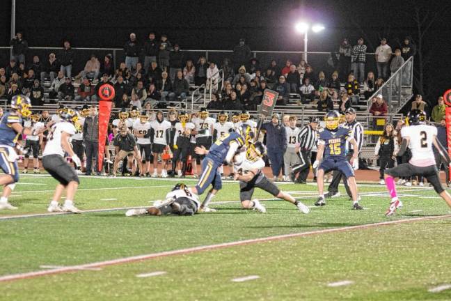 <b>Vernon wideout Gavin Bruno (22) is hit by West Milford linebacker Cole Czerepak in the first half. Bruno caught one touchdown pass. The Vikings won, 21-0, at home Friday, Oct. 25. (Photos by George Leroy Hunter)</b>