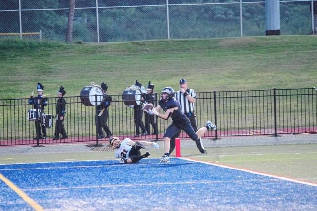 <b>WJ3 A West Milford defensive back falls to the turf as Jefferson receiver Christopher Connolly catches a long-range pass resulting in a touchdown late in the second quarter. </b>