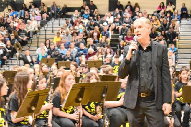 Brian McLaughlin speaks to the audience at the annual All District Arts Festival on March 27.