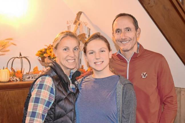 Jill’s House Weekend Adventure camper Julia de Grandpré of Old Tappan with her parents, Kim and Marc. (Photo by Rich Adamonis)