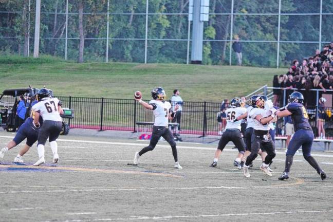 <b>West Milford quarterback Aydin Deane throws the ball in the first half.</b>