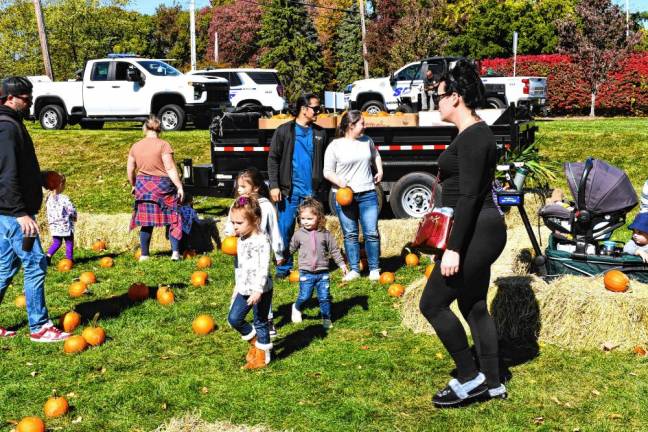 Children explore a pumpkin patch during the third annual Harvest Festival sponsored by the Passaic County Sheriff’s Office on Saturday, Oct. 12 at Bubbling Springs Park. (Photo by Maria Kovic)