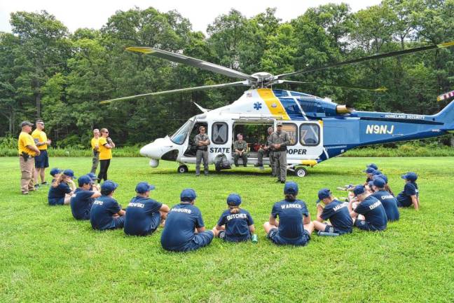 State Police Trooper and helicopter pilot Matt Sullivan briefs cadets on airborne policing and answers questions.