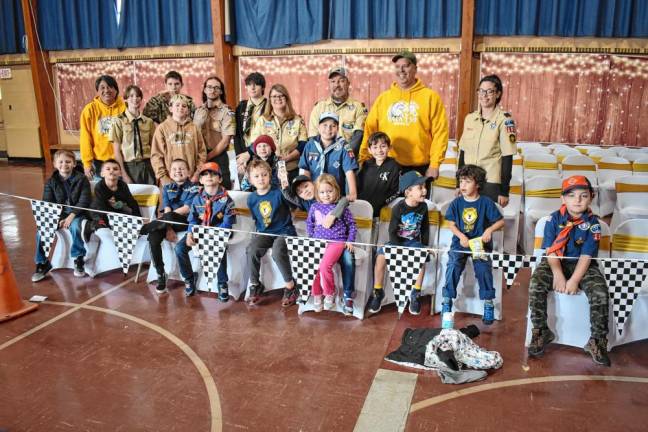 PD6 Members of Troop 159 and their leaders are ready for the Pinewood Derby to begin.