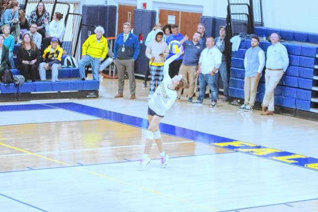 Jefferson's Carsyn Giessuebel in the midst of a serve.