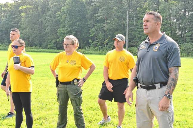 Police Chief Shannon Sommerville, right, and other instructors watch the cadets.