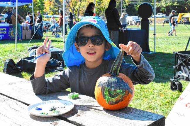 Sean Kim of Wayne with a painted pumpkin.