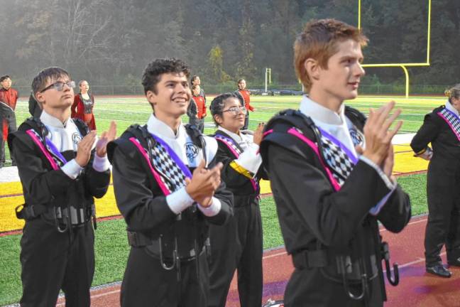 Members of the West Milford High School band applaud during the awards presentation.