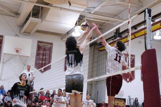 Aiden Rosenberg of West Milford and Summit’s Oliver Hogan face off at the net.