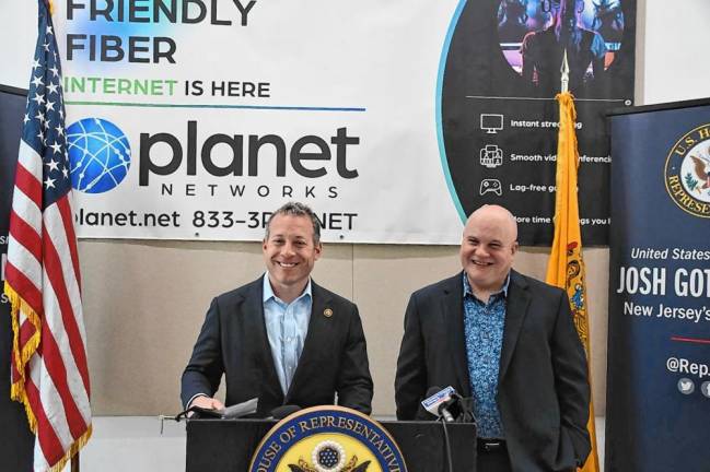 Rep. Josh Gottheimer, D-5, stands beside Robert Boyle, right, founder and chief executive of Planet Networks, which is based in Newton. (Photo provided)