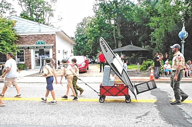 Cub Scout Pack 121’s float depicts “Gloria,” a rocket plane that launched air mail on Greenwood Lake in 1936.(Photo by Ed Bailey)