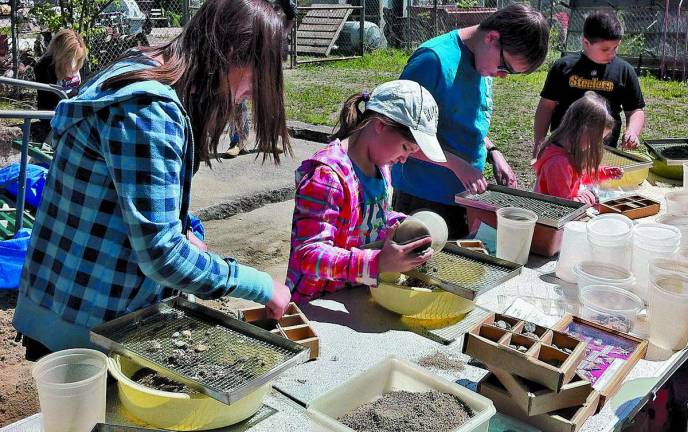 Participants of all ages get to dig and sort through fossils in the Fossil Discovery Center at the Sterling Hill Mining Museum in Ogdensburg.