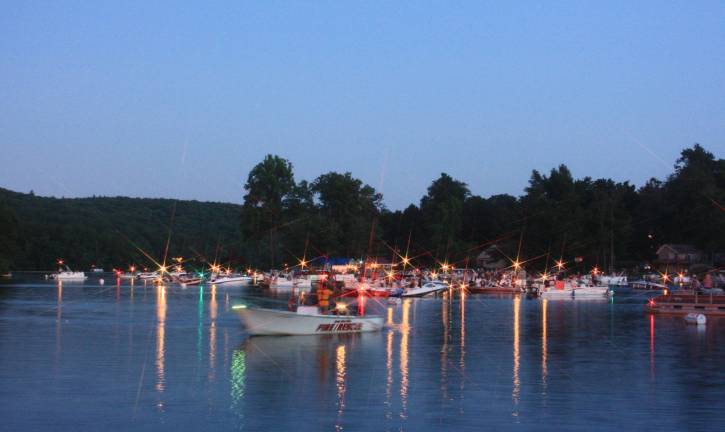 Photos by Ginny Raue The Upper Greenwood Lake annual Fourth of July fireworks display brought out the lake's residents for a night of fun on the water. The boats themselves made for a great sight, with their lights glistening and reflecting on the water. The almost full moon was the perfect backdrop for the fireworks. For more photos, go to westmilfordmessenger.com.