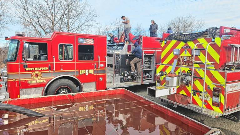 Members of Greenwood Forest Fire Company #3 do a mandatory annual equipment evaluation and inspiration Nov. 19. (Photo by Rich Adamonis)