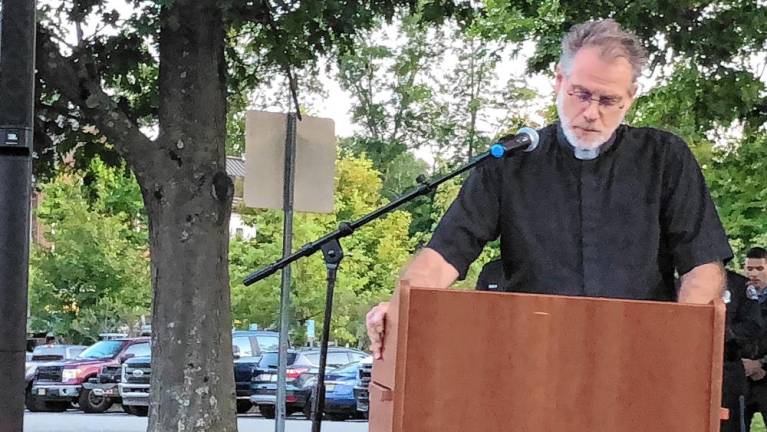 The Rev. Christopher Doyle gives the closing prayer.