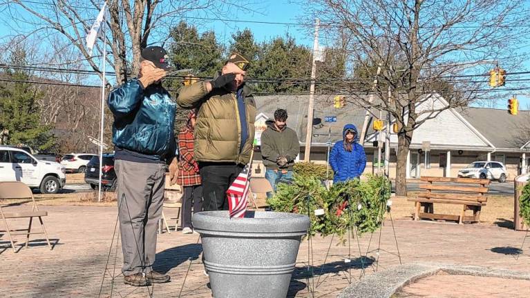 Veterans salute after placing wreaths in honor of each U.S. military branch during the Wreaths Across American ceremony Saturday, Dec. 14 at Veterans Memorial Park.