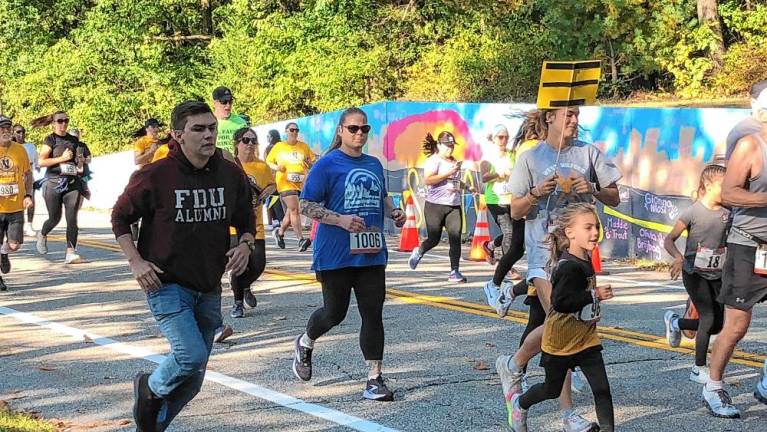 Boy wins 5K benefiting schools