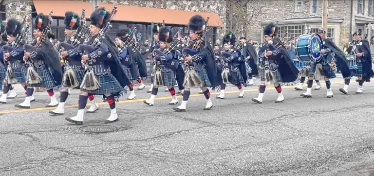 The Ancient Order of Hibernians’ Pipe Band Div. 1 marches down Main Street.