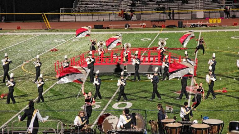 <b>The Vernon Township High School Marching Band and Color Guard perform during halftime of the game with Mount Olive on Oct. 11</b>. (Photos by George Leroy Hunter)