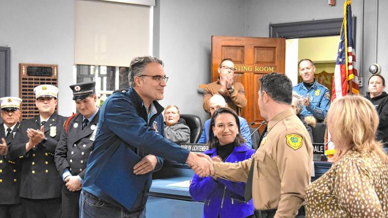 Assemblyman Christian Barranco and Assemblywoman Aura Dunn, both R-25, thank Christopher Franek, assistant division firewarden with the New Jersey Forest Fire Service. He was the incident commander during the Jennings Creek wildfires last fall. (Photos by Fred Ashplant)