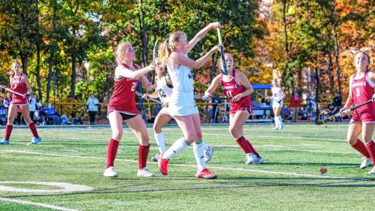 Brodie Loveland of West Milford reaches up to knock down a pass made late in the fourth quarter of the Passaic County Tournament final Saturday, Oct. 24 at Passaic Tech. Pompton Lakes won, 2-1, taking the title for the third year in a row. (Photos by Glenn Clark)