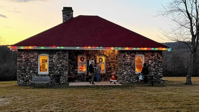 The Wallisch Homestead’s Creamery is lit up from 5 to 9 each evening in December so people can peek through the windows and see how Christmas used to be celebrated. (Photos by Denise von Wilke)