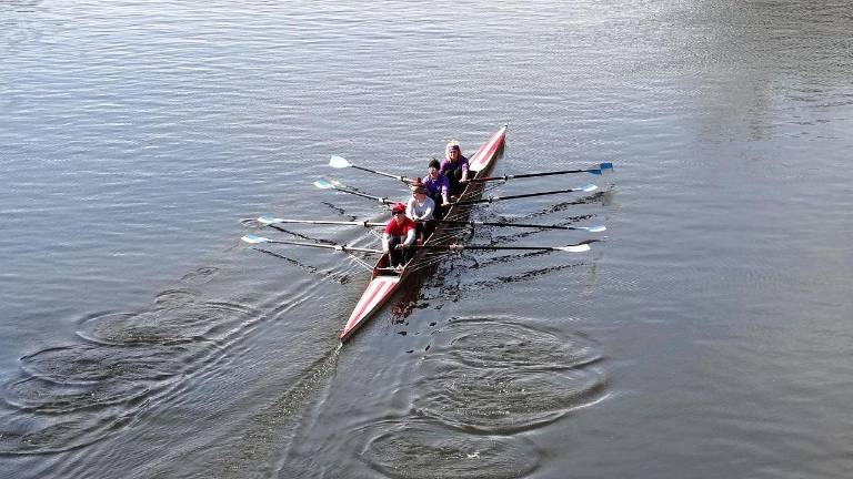 Rowers in a four-person boat.